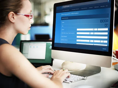 woman using computer for patient registration