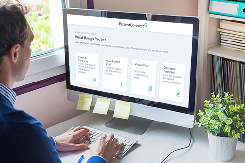 man using computer for scheduling