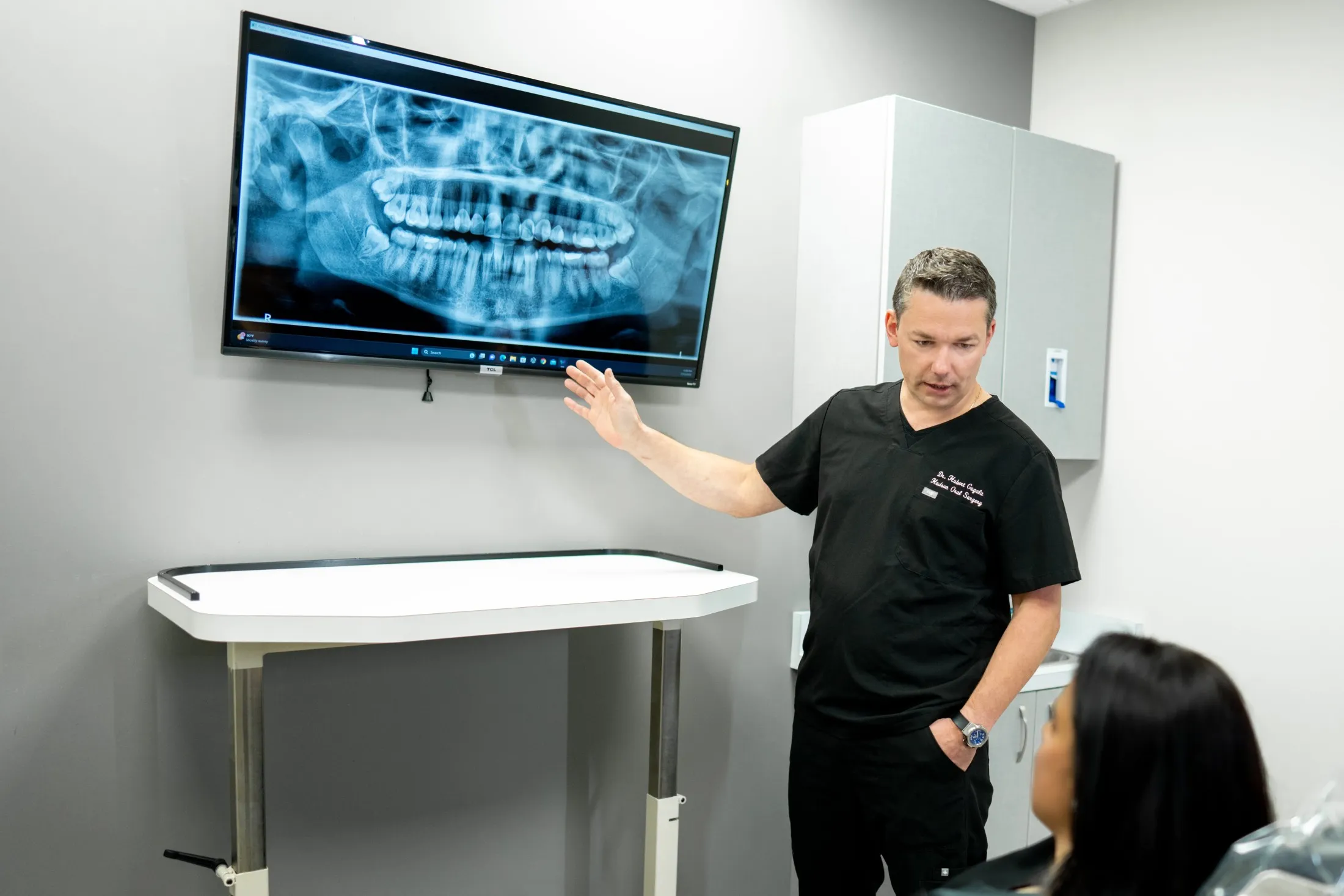 Dr. Hubert Gugala with patient - min